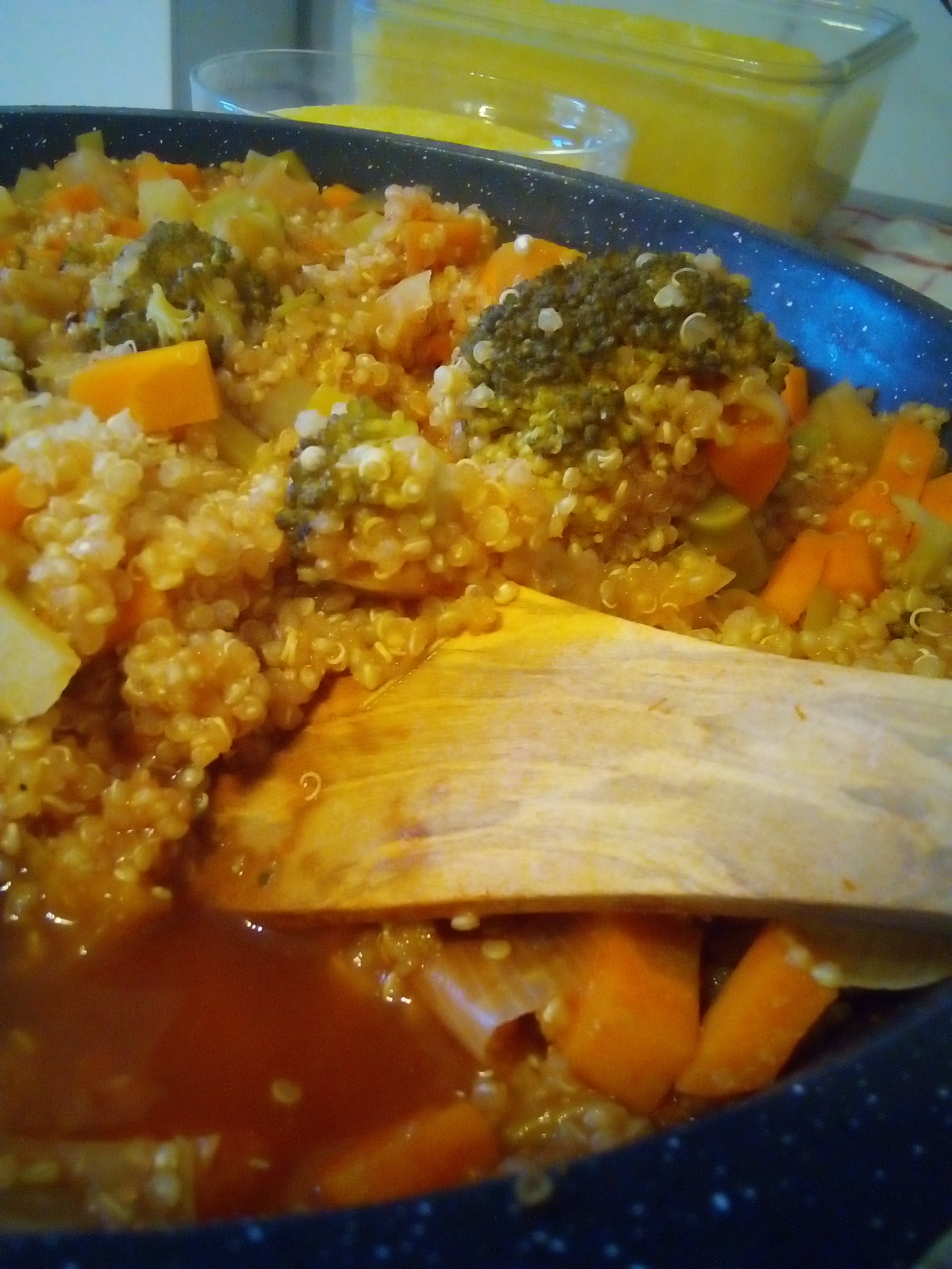 Quinoa stew with carrots, leek, potato, tomato paste and spices simmering in one pot