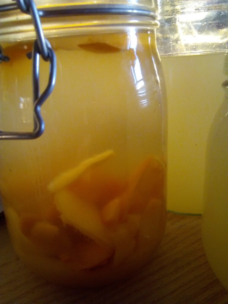 Straining apple pieces after first week of vinegar fermentation