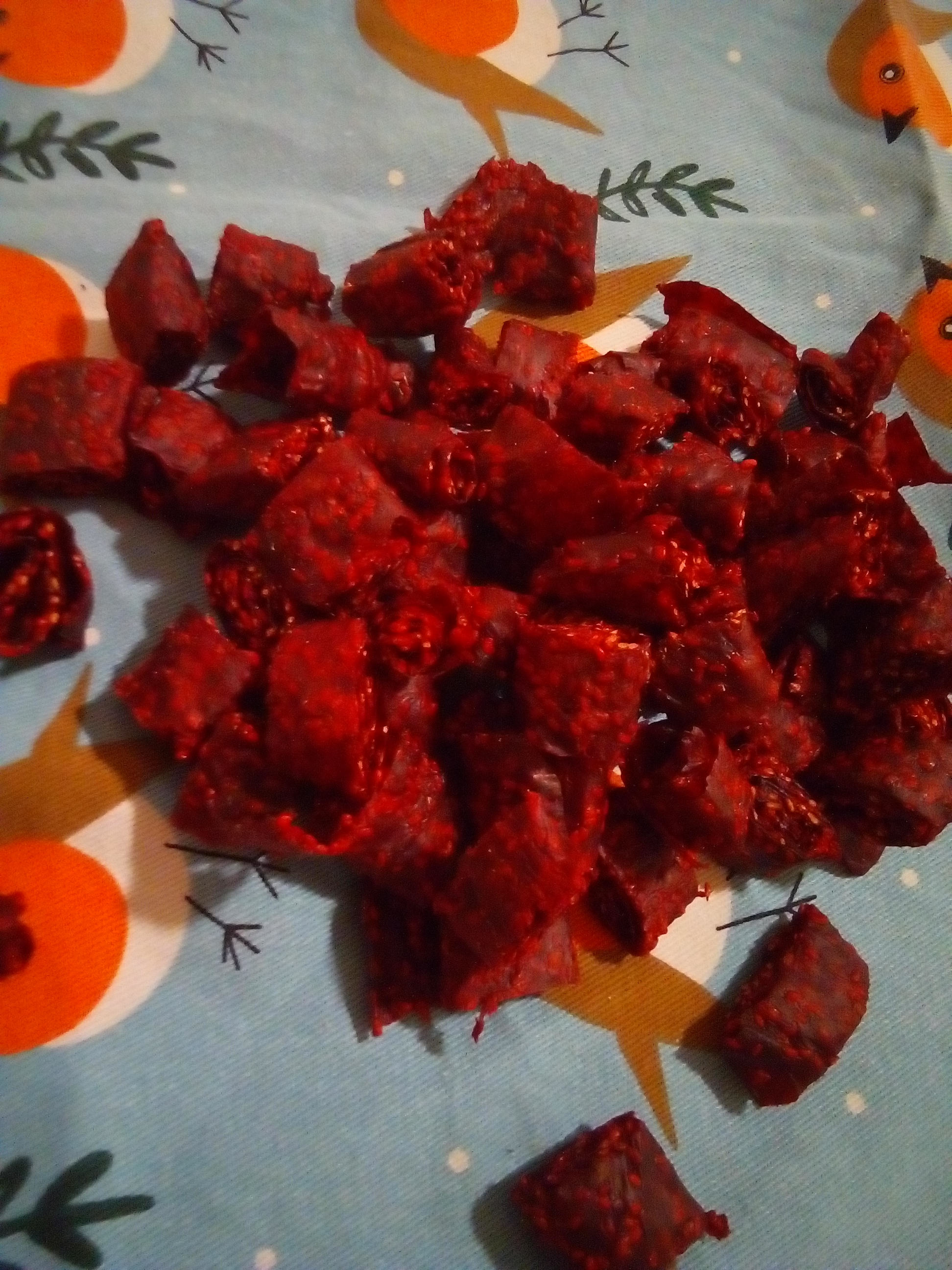 Sugar-free homemade fruit leather strips stored in glass jars.