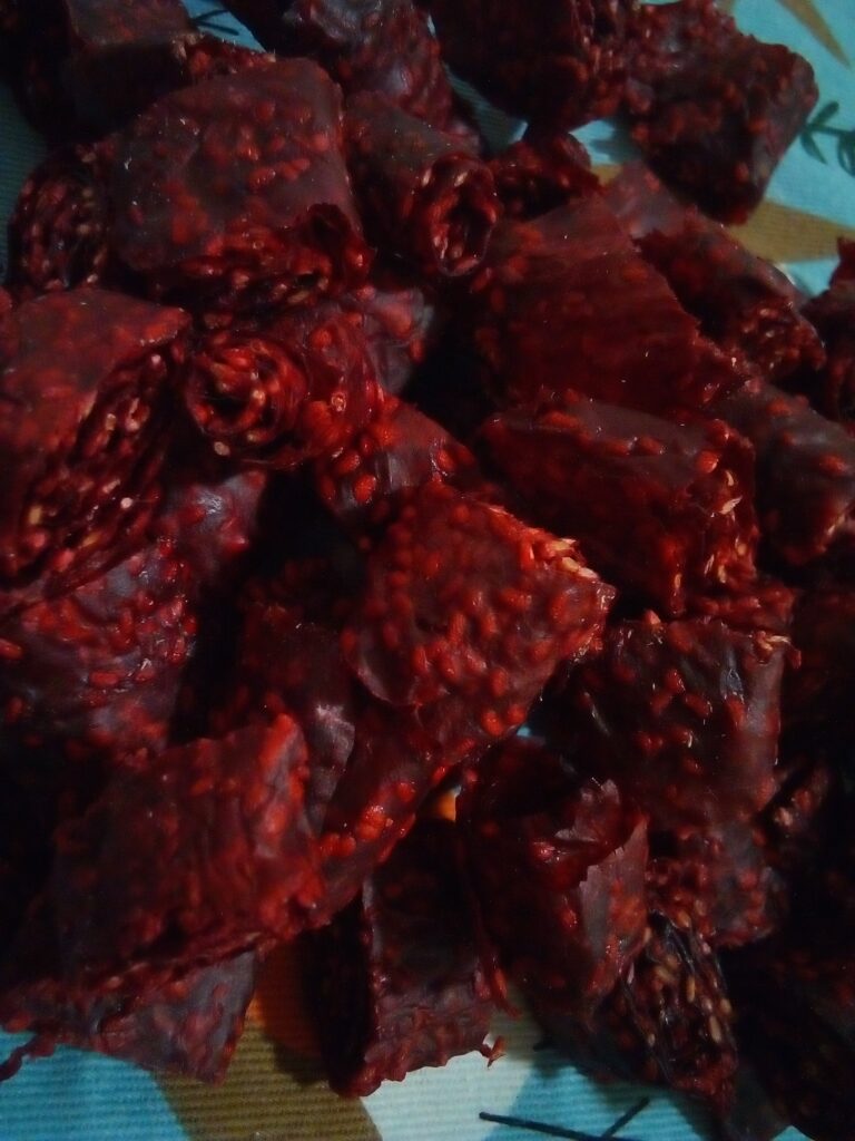 Homemade fruit leather with honey as natural sweetener, rolled on parchment.