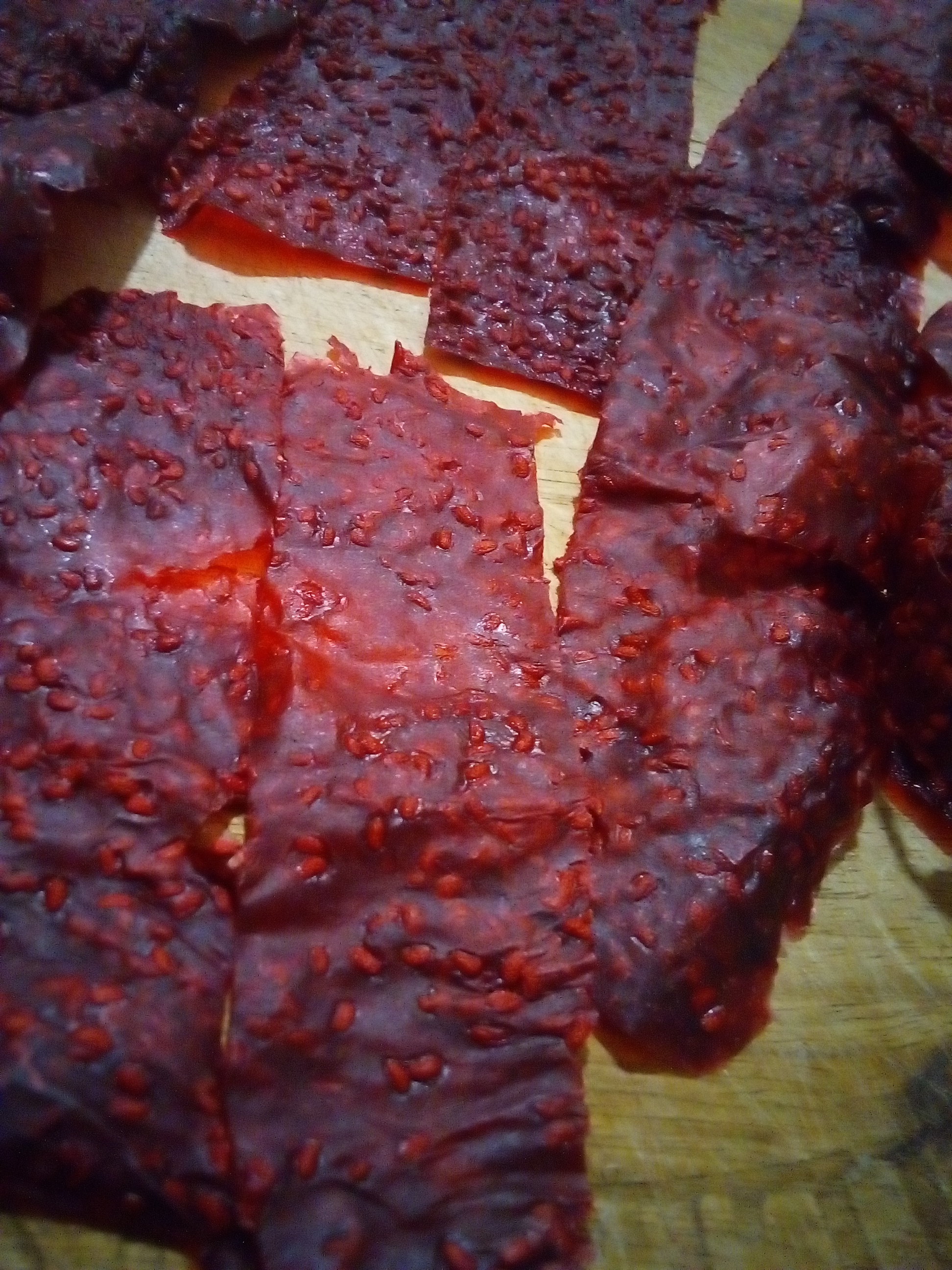 Frozen berries blended into puree for homemade fruit leather.