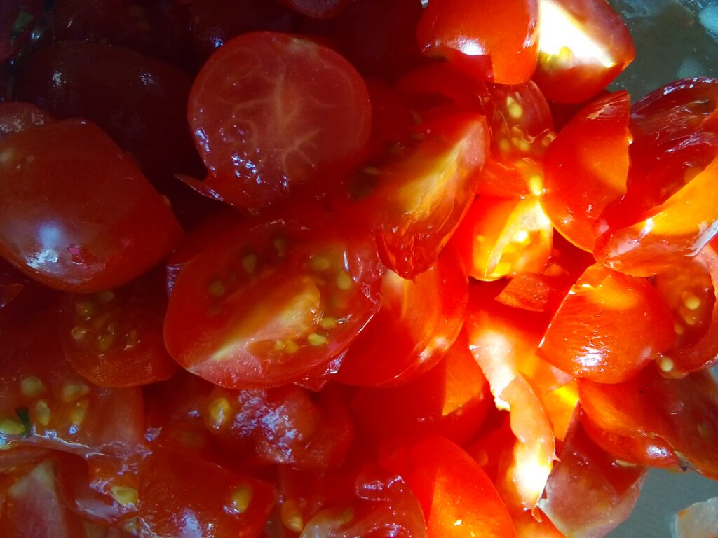 Sun-ripened tomatoes prepared for a juicy tomato salad without onions.