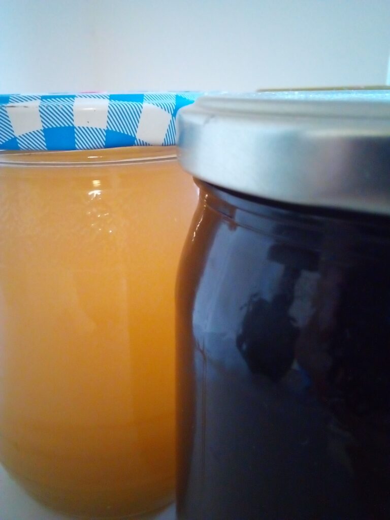 Fresh gooseberry juice in glass jar, made without a juicer.