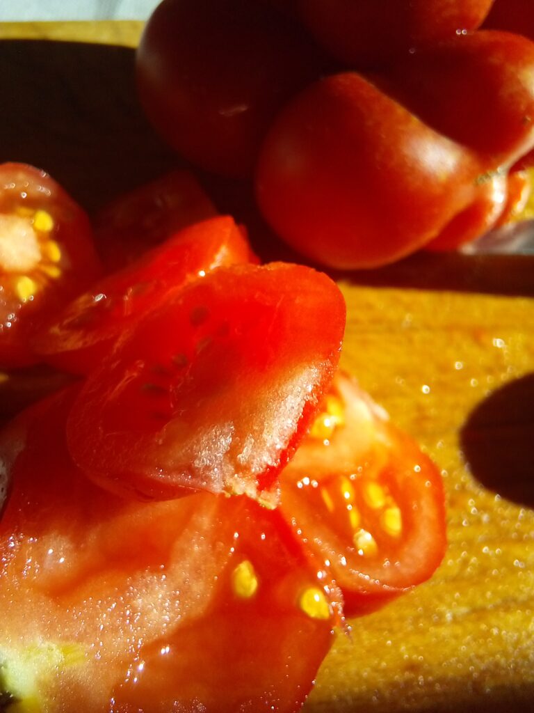 Juicy tomato salad without onions on a rustic wooden table