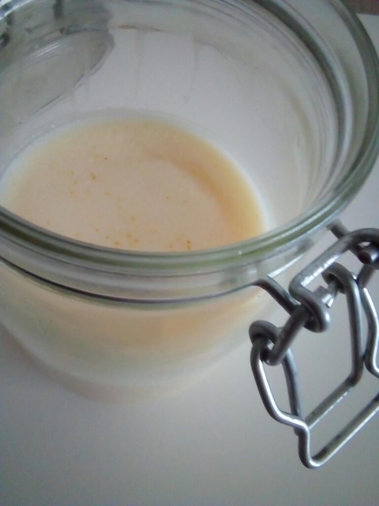 1.	Filtering goose fat with tea filters in a homestead kitchen using simple tools.