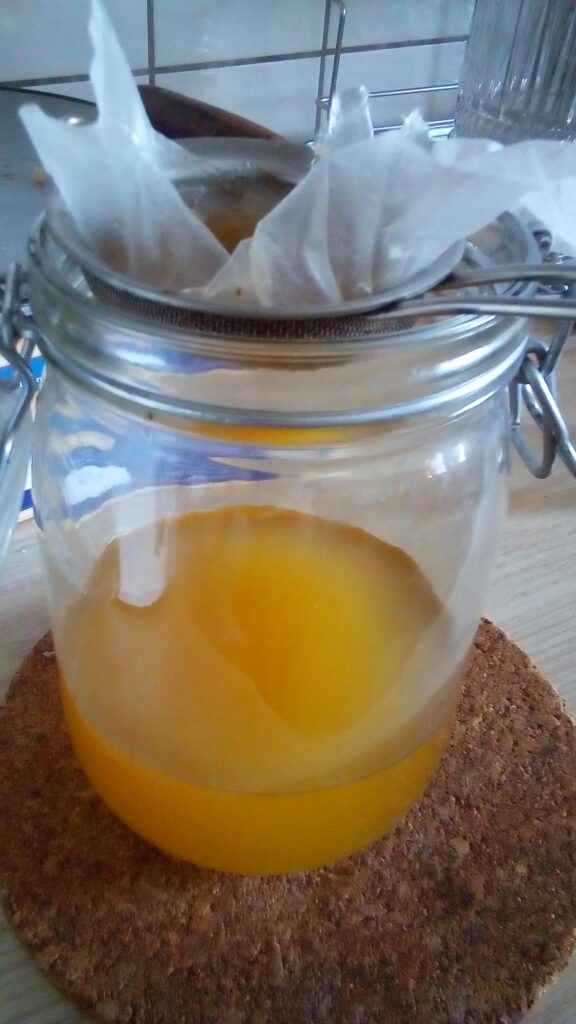 Simple kitchen setup for filtering goose fat at home.