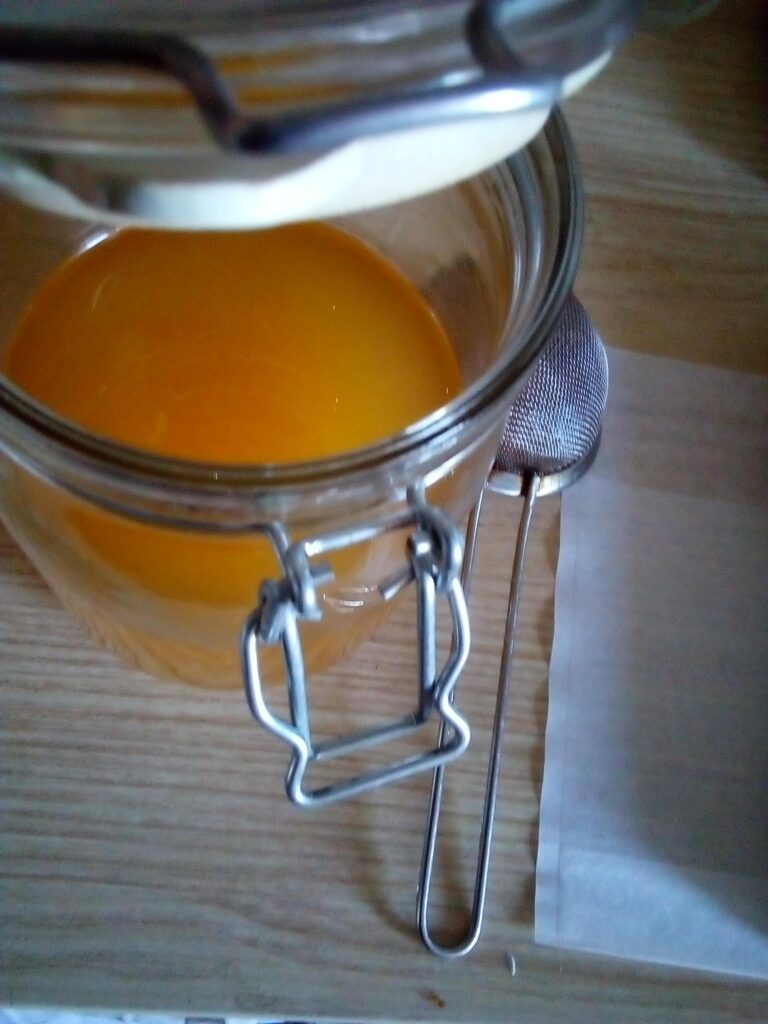 Traditional method of rendering and filtering goose fat.