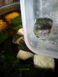 Clear beef soup cooking with bone broth and vegetables showing a gentle simmer for traditional homestead style soup preparation.