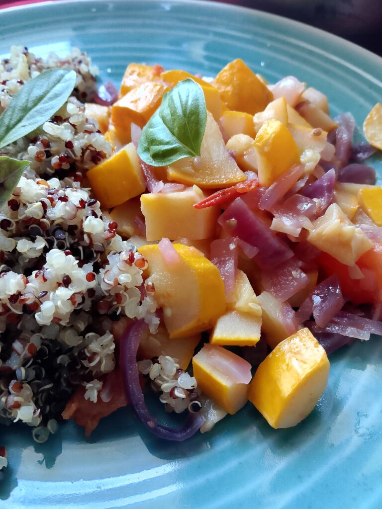 Busy mom cooking a quick zucchini tomato skillet between meetings