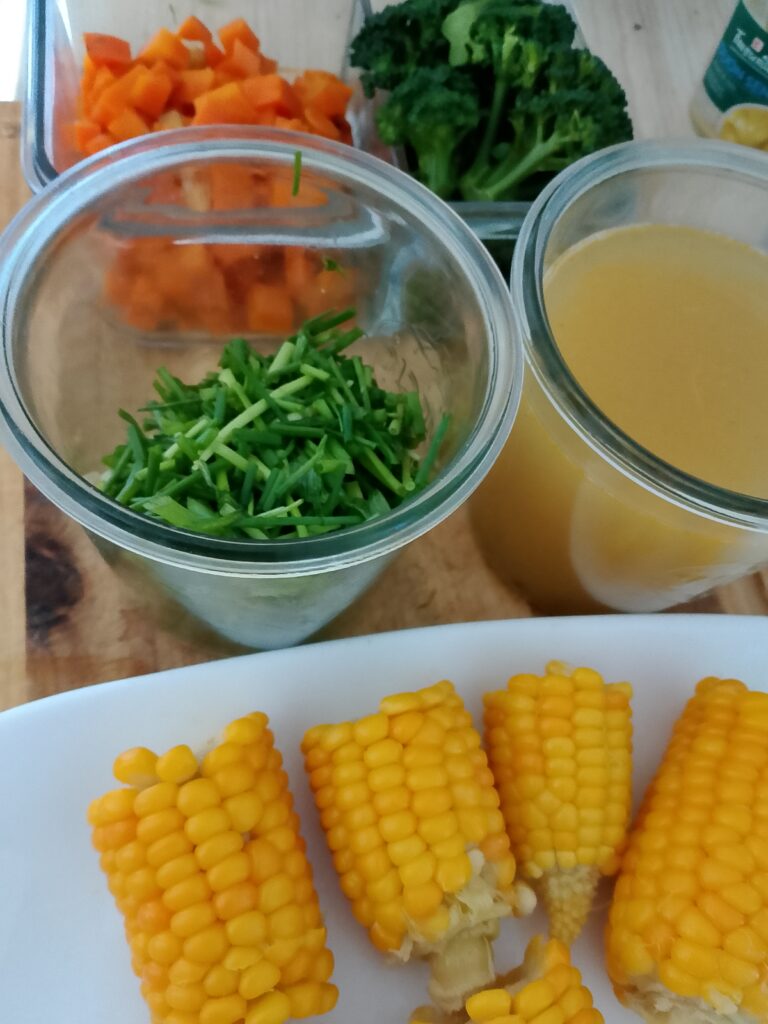 How to meal prep vegetables for the week by cooking prepared garden vegetables in broth until tender, then draining them and serving or storing them separately.