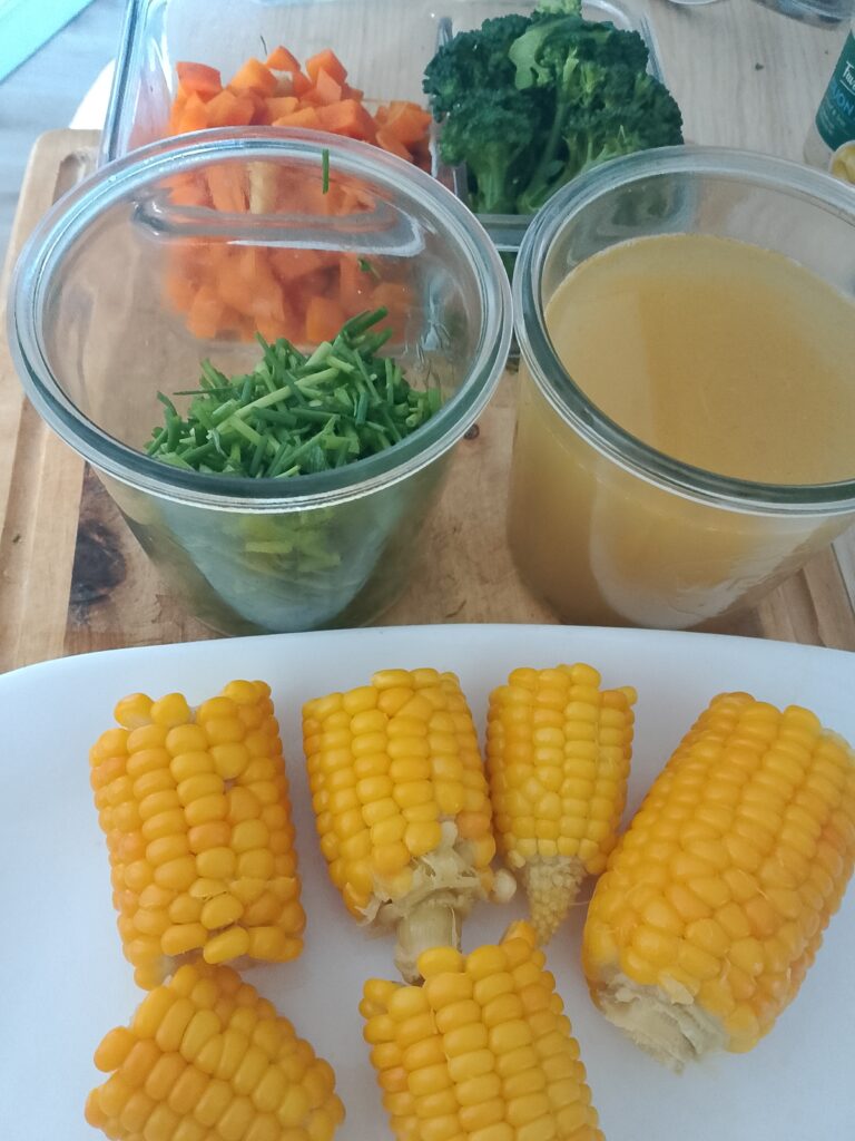 How to meal prep vegetables for the week: cooked corn is an easy vegetable to prepare ahead and serve later as part of a simple family vegetable buffet.